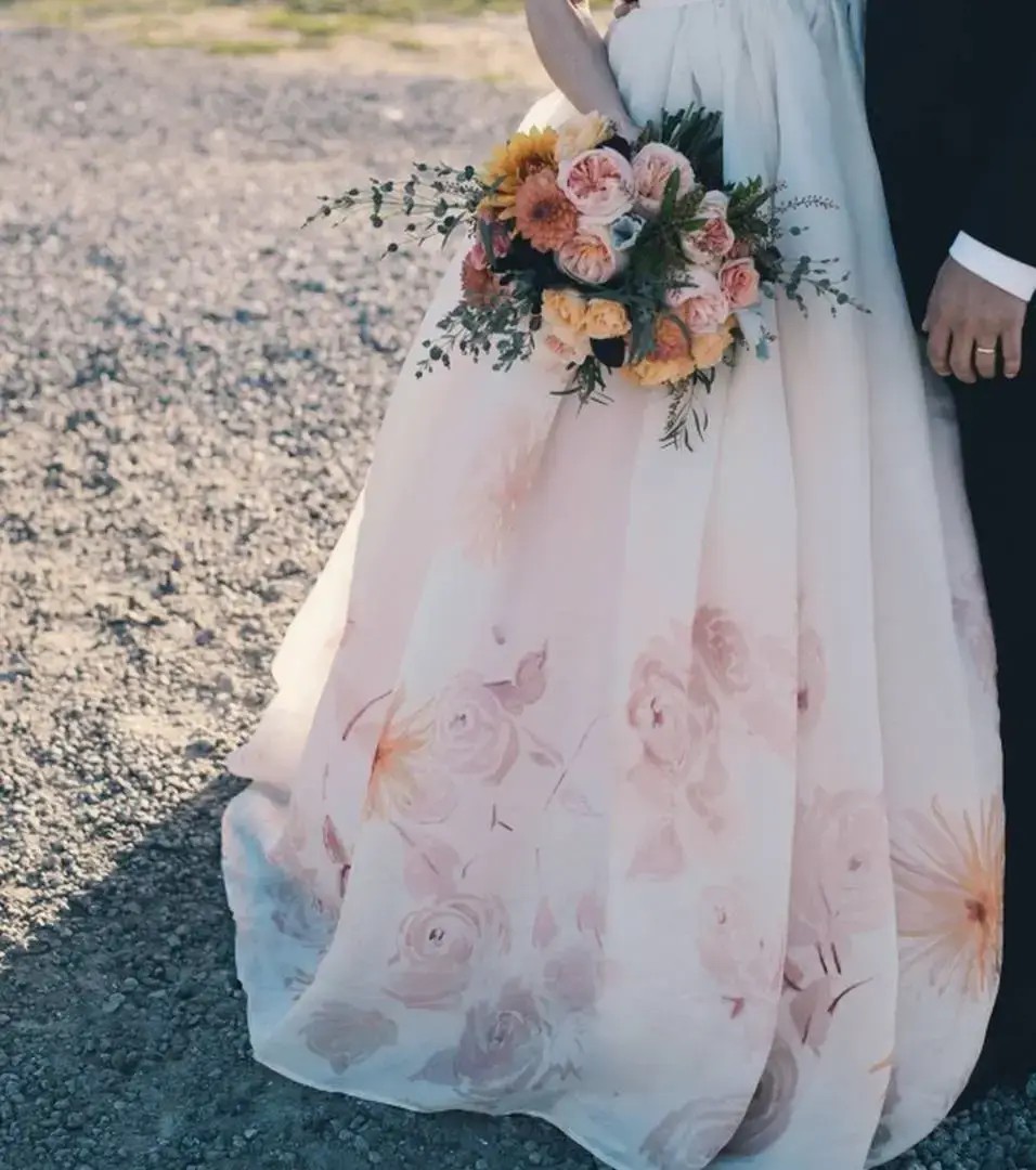 Accessorising a floral wedding dress.